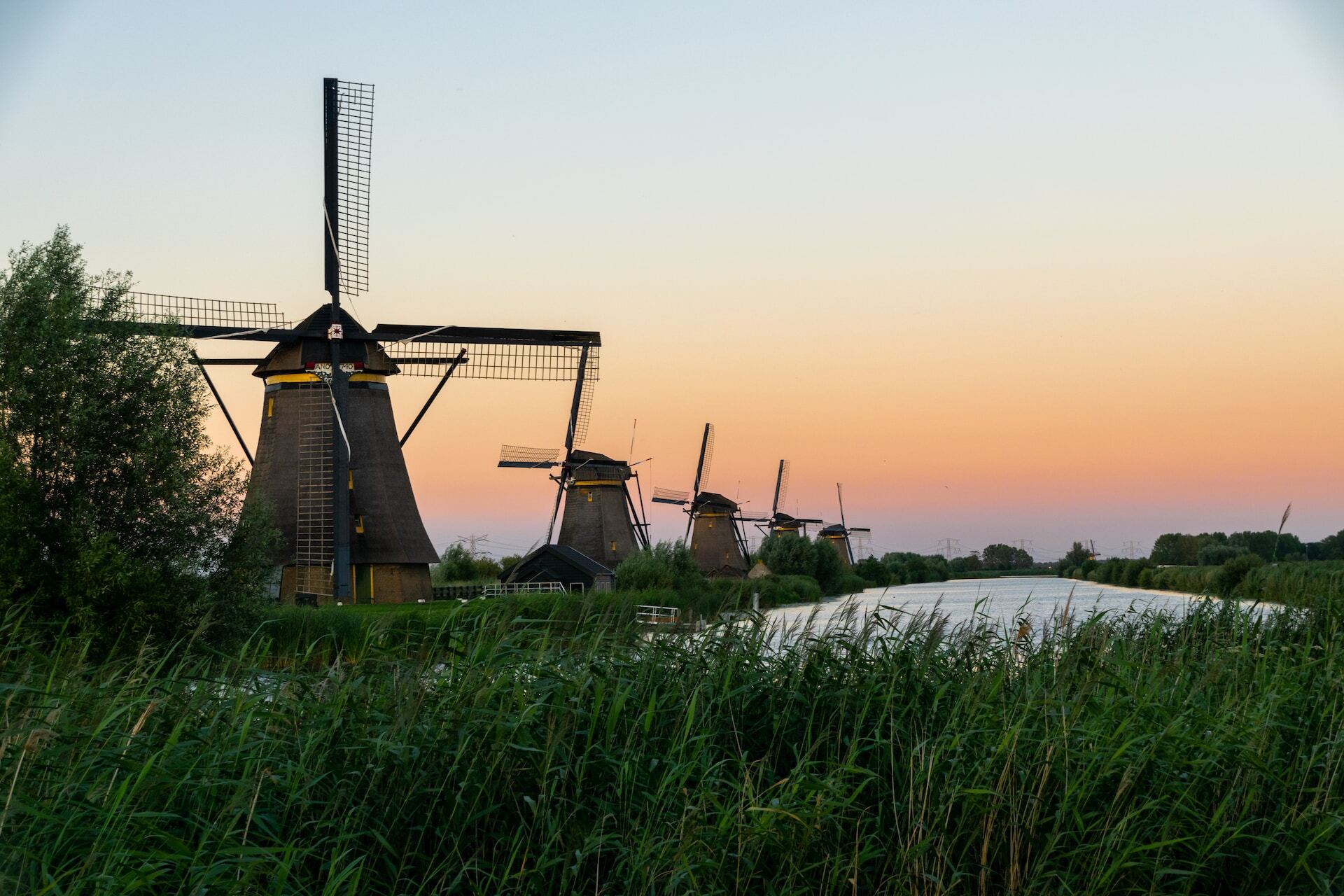 A row of five Dutch windmills